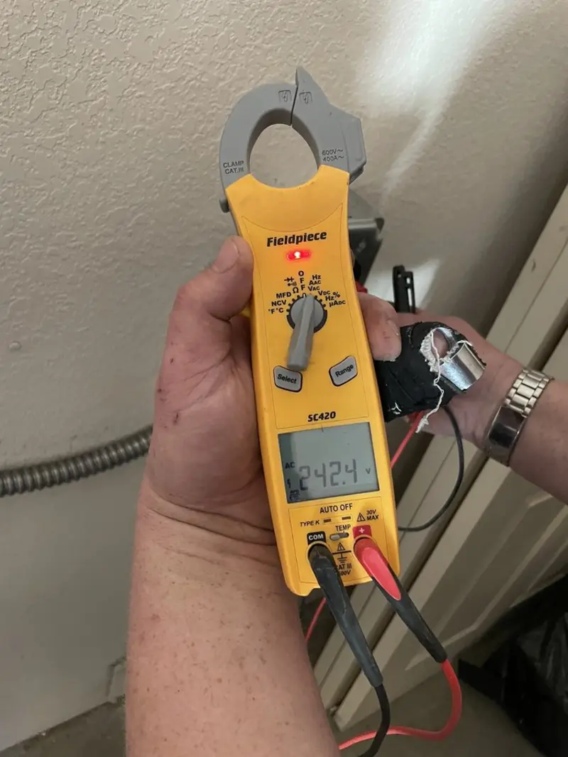 Voltage testing with clamp meter during Electrical Installation Services in Silver Spring